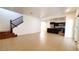 Expansive living area with tile flooring, staircase, and a bright, open layout perfect for entertaining at 145 Forest Crossing Ct, Las Vegas, NV 89148
