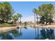 Scenic pond with a reflection of the community behind at 145 Forest Crossing Ct, Las Vegas, NV 89148