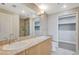 Bathroom featuring double sinks, large mirror, and walk-in closet at 150 Las Vegas Blvd # 1716, Las Vegas, NV 89101