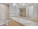 Bathroom featuring double sinks, large mirror, and decorative shower at 150 Las Vegas Blvd # 1716, Las Vegas, NV 89101