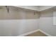A walk-in closet features neutral colored walls, carpet, and closet rod at 150 Las Vegas Blvd # 1716, Las Vegas, NV 89101