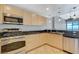 Well-equipped kitchen features granite counters, stainless steel appliances and pendant lighting at 150 Las Vegas Blvd # 1716, Las Vegas, NV 89101