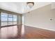 Bright living room offering hardwood floors and expansive windows showcasing the city skyline and mountains at 150 Las Vegas Blvd # 1716, Las Vegas, NV 89101