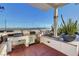 A covered outdoor kitchen has stone counters, a grill, and a mini fridge at 150 Las Vegas Blvd # 1716, Las Vegas, NV 89101