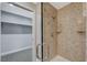 Shower with glass door, rain shower head, and walk-in closet at 150 Las Vegas Blvd # 1716, Las Vegas, NV 89101