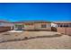 The backyard boasts desert landscaping and a patio area, perfect for outdoor enjoyment at 1604 Lazy Hill Ranch Way, North Las Vegas, NV 89081