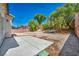 The backyard boasts desert landscaping and a patio area, perfect for outdoor enjoyment at 1604 Lazy Hill Ranch Way, North Las Vegas, NV 89081