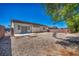 The backyard boasts desert landscaping and a patio area, perfect for outdoor enjoyment at 1604 Lazy Hill Ranch Way, North Las Vegas, NV 89081