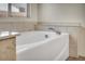 Close up on a soaking tub with a window at 1604 Lazy Hill Ranch Way, North Las Vegas, NV 89081