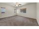 Bedroom featuring neutral walls, carpet flooring and multiple windows allowing for natural light at 1604 Lazy Hill Ranch Way, North Las Vegas, NV 89081