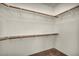Empty walk-in closet with shelving and carpeted floor at 1604 Lazy Hill Ranch Way, North Las Vegas, NV 89081