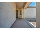 Inviting covered front entrance with a concrete walkway leading to the home's front door at 1604 Lazy Hill Ranch Way, North Las Vegas, NV 89081