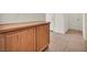 Hallway cabinet with tile flooring leading to doors at 1604 Lazy Hill Ranch Way, North Las Vegas, NV 89081