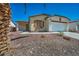 Charming single-story home with a well-manicured desert rock front yard and an attached two-car garage at 1604 Lazy Hill Ranch Way, North Las Vegas, NV 89081
