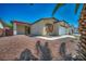 Charming single-story home with a well-manicured desert rock front yard and an attached two-car garage at 1604 Lazy Hill Ranch Way, North Las Vegas, NV 89081