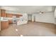 Kitchen with breakfast bar, appliances, tile flooring, and access to living area at 1604 Lazy Hill Ranch Way, North Las Vegas, NV 89081