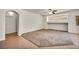 Cozy living area featuring carpet, tile, and natural light at 1604 Lazy Hill Ranch Way, North Las Vegas, NV 89081