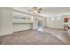 Expansive living space with carpet, tile, natural light, and an open layout at 1604 Lazy Hill Ranch Way, North Las Vegas, NV 89081