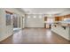 Living space with tile floors, sliding door access to the backyard, and kitchen view at 1604 Lazy Hill Ranch Way, North Las Vegas, NV 89081