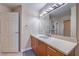 Bright bathroom with modern vanity, granite countertops, and plenty of storage space at 200 W Sahara Ave # 2210, Las Vegas, NV 89102