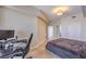 Comfortable bedroom boasts an office area, a plush bed, and serene decor at 200 W Sahara Ave # 2210, Las Vegas, NV 89102