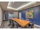 Modern conference room with a large wood table, seating for ten, and attractive art at 200 W Sahara Ave # 2210, Las Vegas, NV 89102