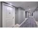 Modern hallway featuring neutral colors, geometric carpeting, and recessed lighting at 200 W Sahara Ave # 2210, Las Vegas, NV 89102