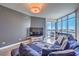 Bright living area with floor-to-ceiling windows offering stunning city views, seamlessly blending indoor-outdoor living at 200 W Sahara Ave # 2210, Las Vegas, NV 89102