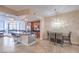 Contemporary living room featuring an island bar, dining set, and city views at 200 W Sahara Ave # 2210, Las Vegas, NV 89102