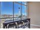 Bright sitting area with floor-to-ceiling windows offering expansive views of the Las Vegas skyline and surrounding landscape at 200 W Sahara Ave # 2210, Las Vegas, NV 89102