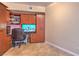 Functional office space features built-in shelving, cabinets, and tiled flooring at 200 W Sahara Ave # 2210, Las Vegas, NV 89102