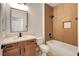 Modern bathroom featuring a tub with tiled walls and a vanity with a white countertop at 2149 Kelsey Creek Ct, Henderson, NV 89044