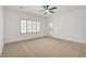 Spacious bedroom with carpet, ceiling fan, and natural light, and a sliding door to the outside at 2149 Kelsey Creek Ct, Henderson, NV 89044