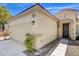 Exterior view of a single-story home highlighting the garage, stone entryway, and neat landscaping at 2149 Kelsey Creek Ct, Henderson, NV 89044