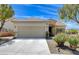Inviting single-story home with a well-maintained front yard and a two-car garage at 2149 Kelsey Creek Ct, Henderson, NV 89044