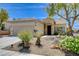 Charming single-story home showcasing desert landscaping and a stone-accented entryway at 2149 Kelsey Creek Ct, Henderson, NV 89044