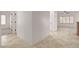 Spacious hallway with neutral tile flooring, leading to bright and airy rooms at 2149 Kelsey Creek Ct, Henderson, NV 89044