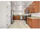 Open kitchen with stainless steel appliances, ample cabinetry, and granite countertops at 2149 Kelsey Creek Ct, Henderson, NV 89044