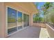 Balcony with sliding glass doors featuring serene views and privacy at 229 N Buteo Woods Ln, Las Vegas, NV 89144