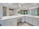 Bright bathroom features large mirrors, dual sinks, and white cabinetry at 229 N Buteo Woods Ln, Las Vegas, NV 89144