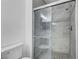 Bathroom featuring a stand up shower with glass door, modern fixtures, and tile flooring at 229 N Buteo Woods Ln, Las Vegas, NV 89144
