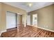 Bedroom boasts hardwood floors, ceiling fan, large closet, and access to ensuite bathroom at 229 N Buteo Woods Ln, Las Vegas, NV 89144