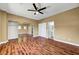 Large bedroom boasts hardwood floors, ceiling fan, large closet, and ensuite bathroom at 229 N Buteo Woods Ln, Las Vegas, NV 89144