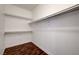 Walk-in closet with laminate wood flooring and shelving at 229 N Buteo Woods Ln, Las Vegas, NV 89144