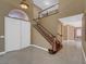 Elegant entryway with stone tile flooring, staircase, and a view of the second floor with bright, natural light at 229 N Buteo Woods Ln, Las Vegas, NV 89144