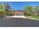 Charming two-story home with a three-car garage, desert landscaping, and a well-maintained lawn at 229 N Buteo Woods Ln, Las Vegas, NV 89144