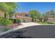 Charming two-story home with a three-car garage, desert landscaping, and a well-maintained lawn at 229 N Buteo Woods Ln, Las Vegas, NV 89144