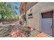 Exterior door on a home with desert landscaping and a walkway at 229 N Buteo Woods Ln, Las Vegas, NV 89144