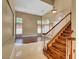 Inviting home foyer featuring wood staircase, soaring ceilings and natural light at 229 N Buteo Woods Ln, Las Vegas, NV 89144
