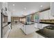 Kitchen with black counters, stainless steel appliances and open concept design at 229 N Buteo Woods Ln, Las Vegas, NV 89144